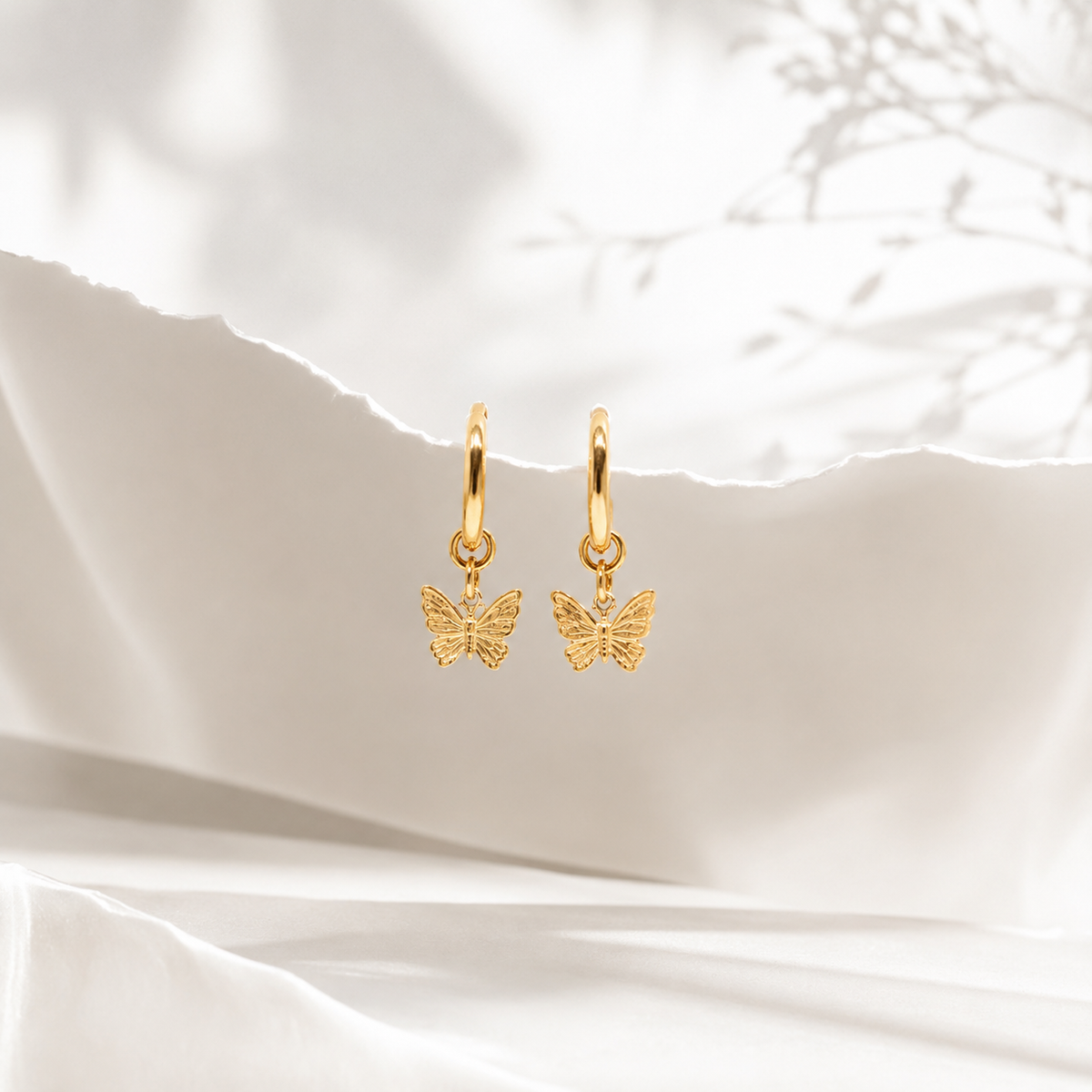 Butterfly Huggie Earrings – product image 5