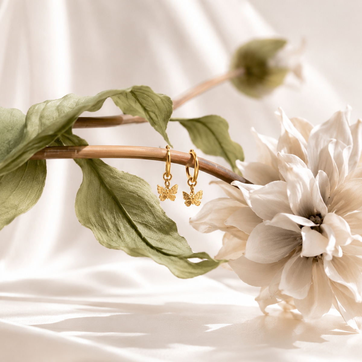 Butterfly Huggie Earrings – product image 6